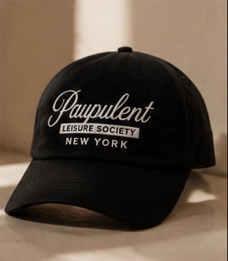 Black cap with white text on a beige background