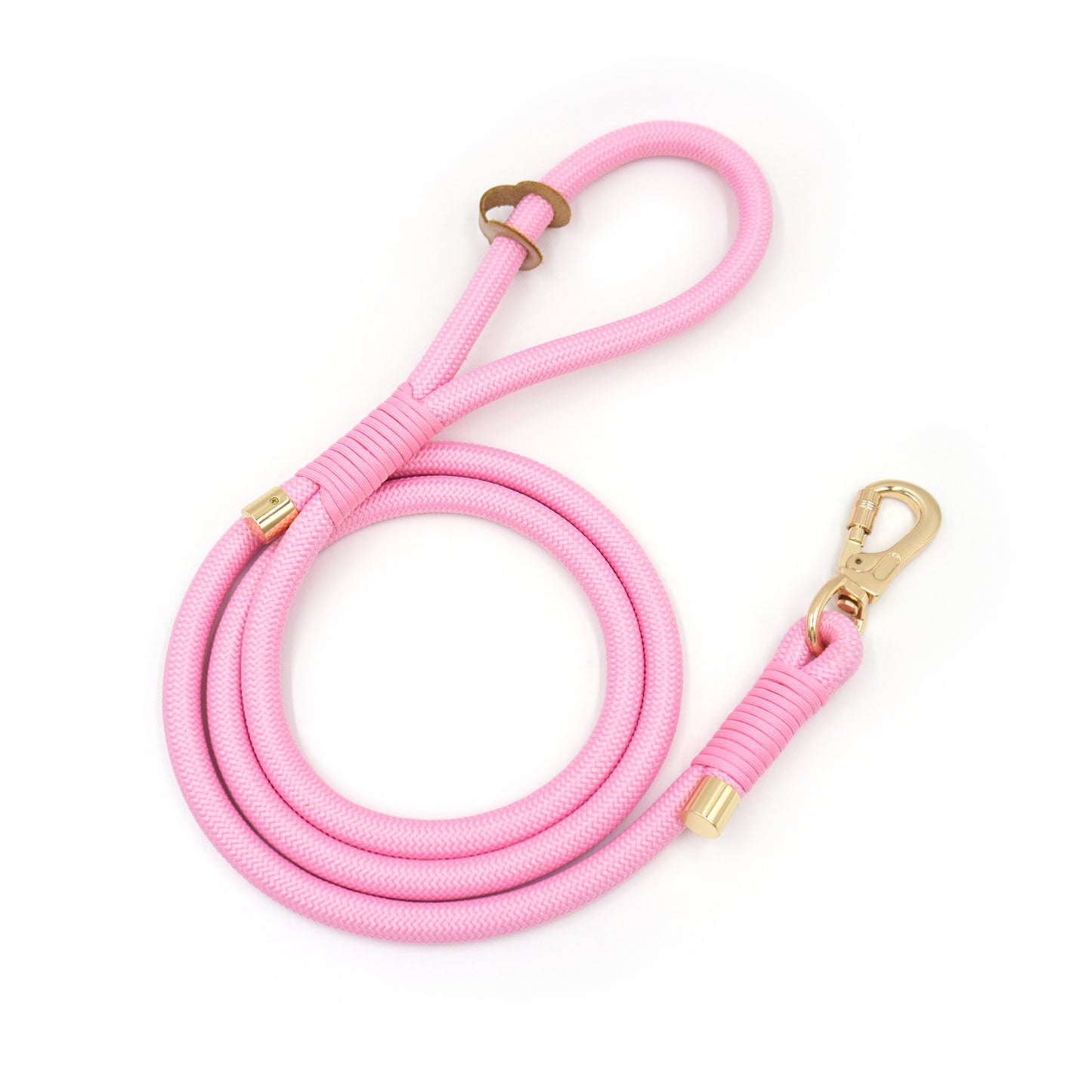 Pink rope  dog leash with gold hardware on a white background
